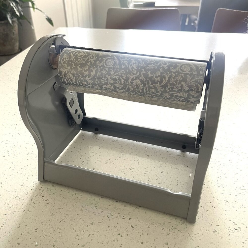 Jeweler's roll gift wrap dispenser and wrapping paper